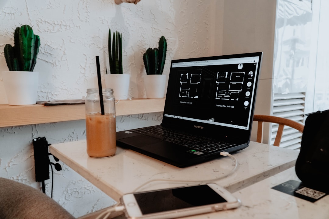 Laptop charging at coffee shop