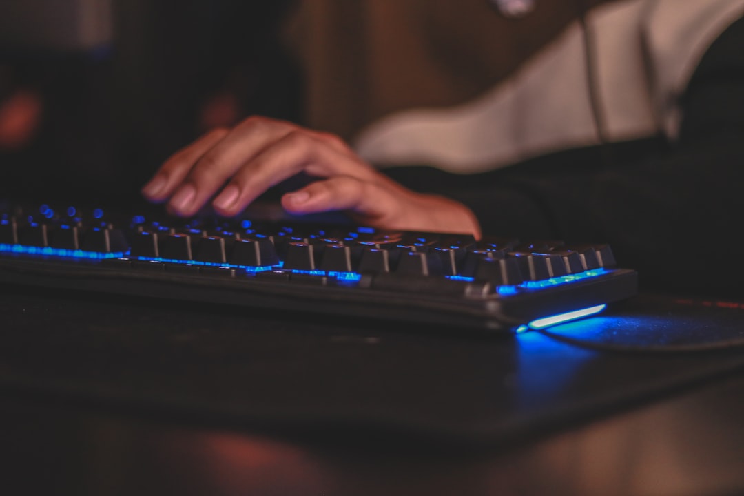 Mechanical keyboard typing hands closeup