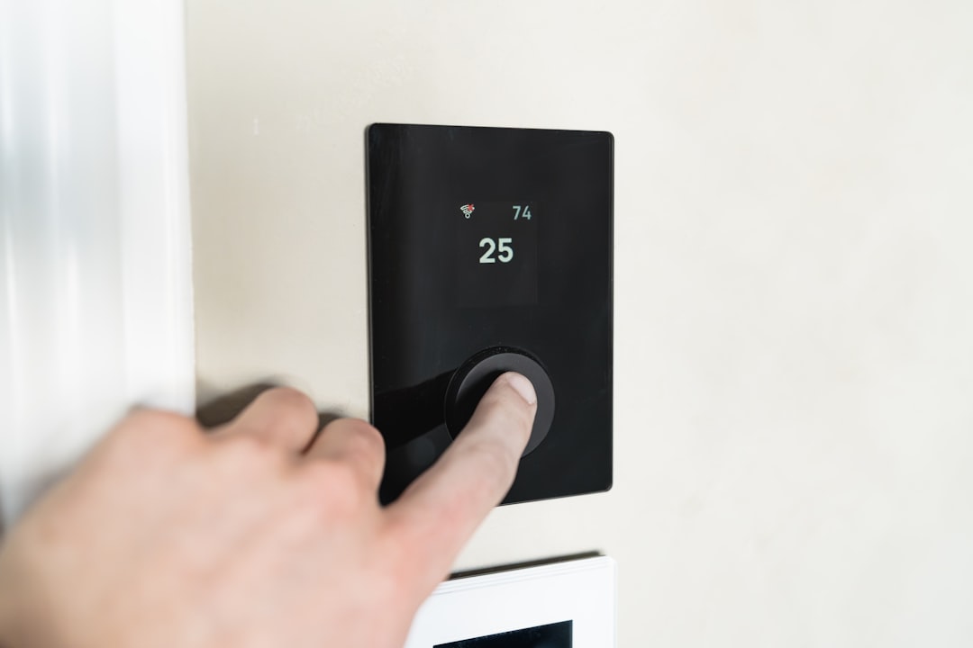 Modern smart thermostat on wall