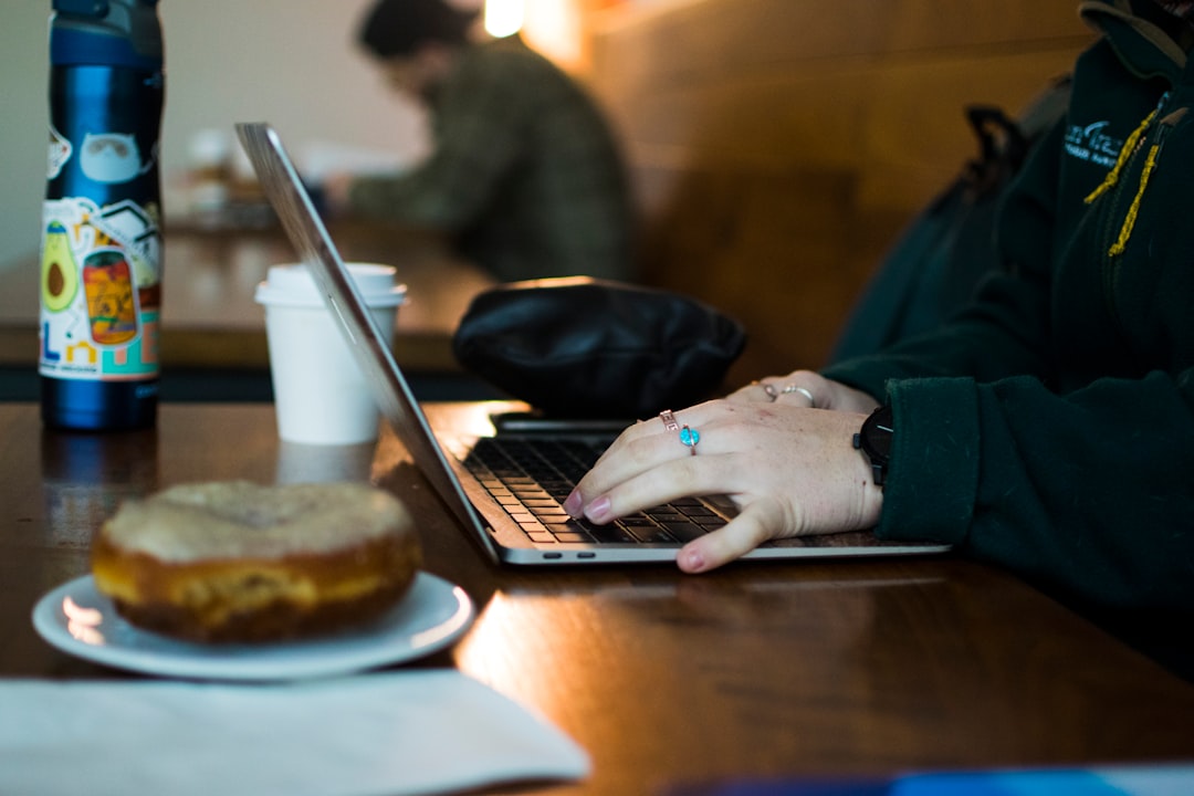 Student using laptop coffee shop working