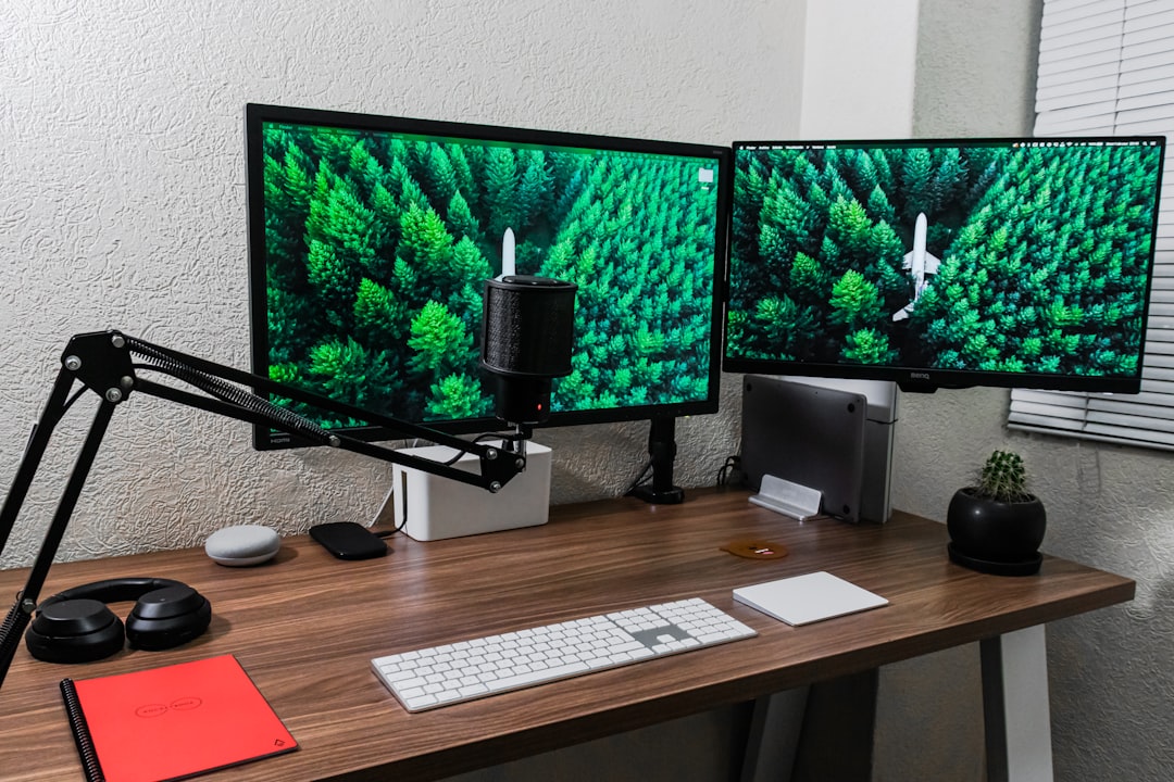Dual monitors mounted on articulating arms