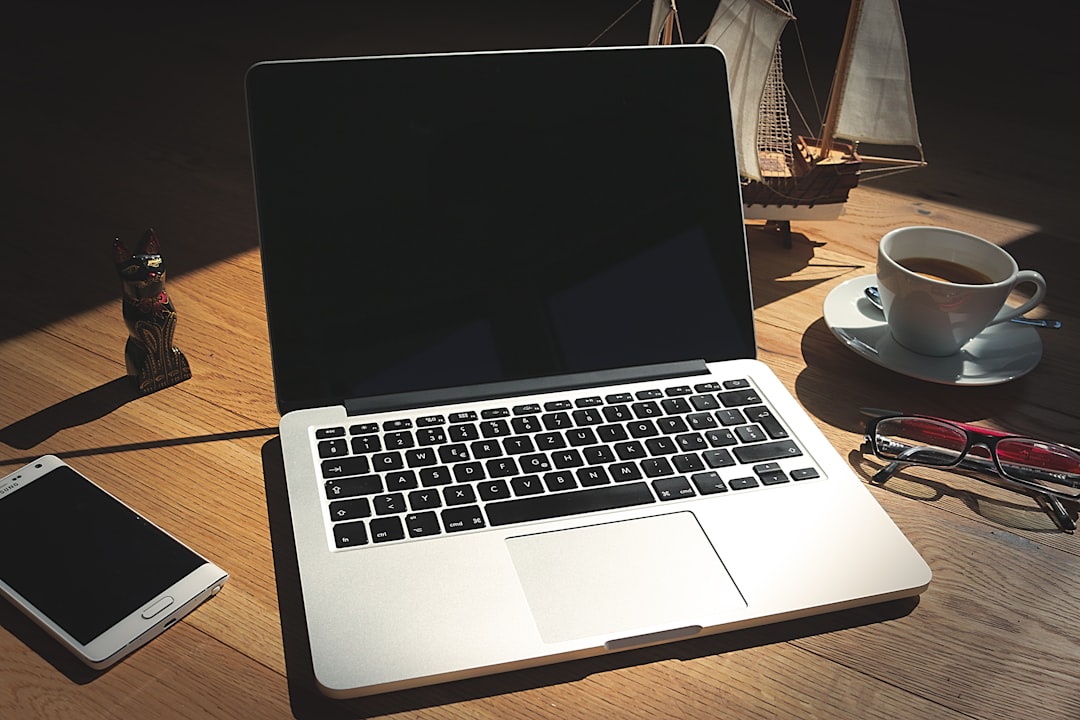 Minimal productive workspace with a large monitor and keyboard