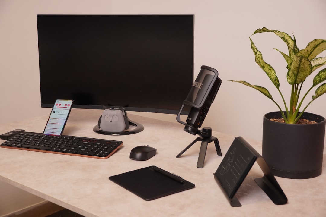 Laptop workspace with portable SSD connected