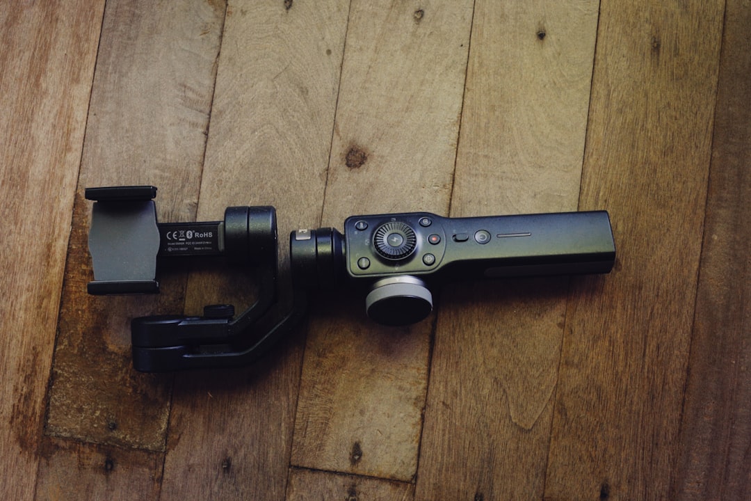 Pocket gimbal camera in hand for stabilized video recording