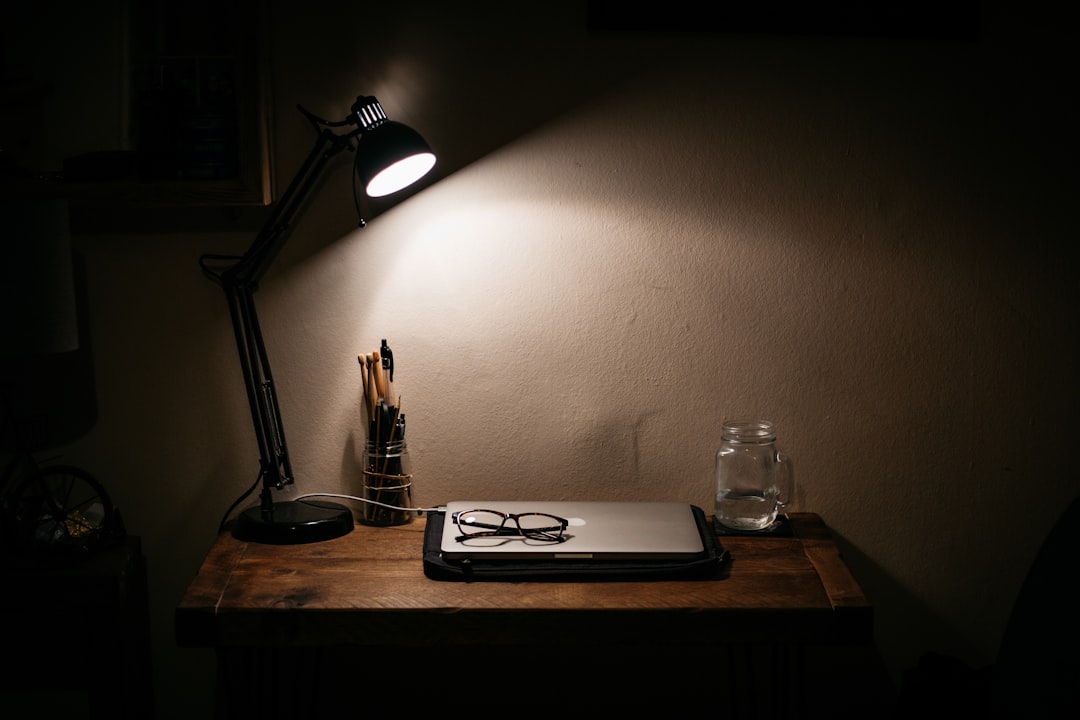 Modern desk lamp illuminating a home office workspace