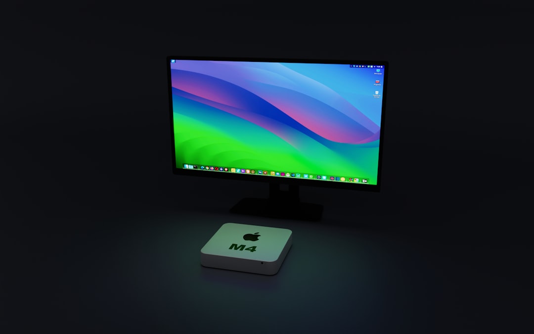 Person working at modern desk with compact computer