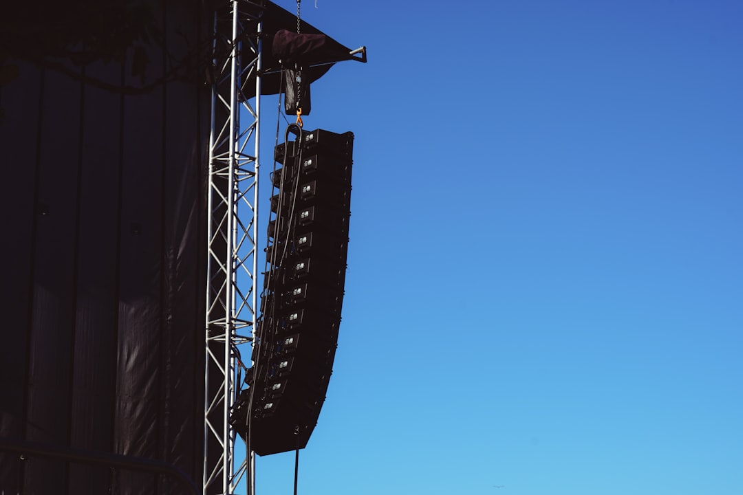 Outdoor speakers mounted on a deck for yard-wide audio