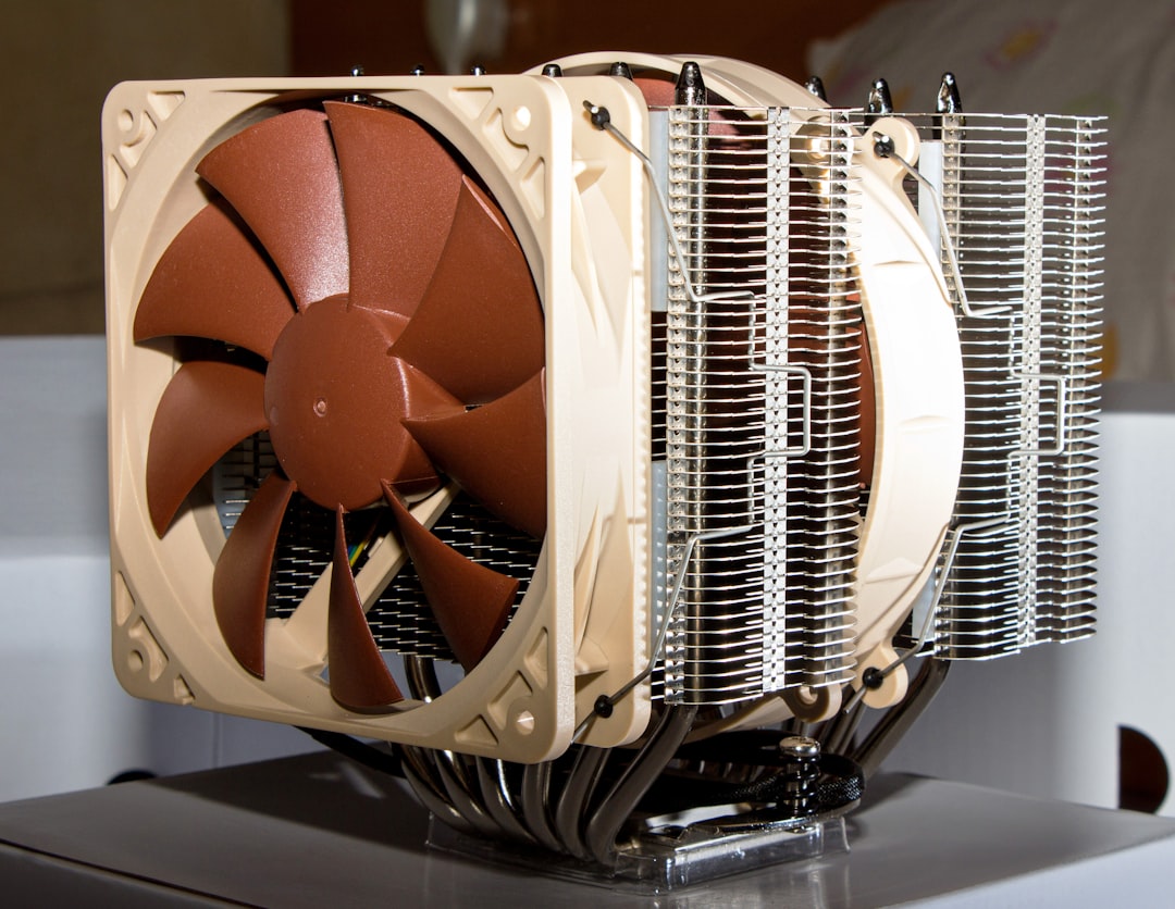 Computer workstation with cooling fans managing thermal load
