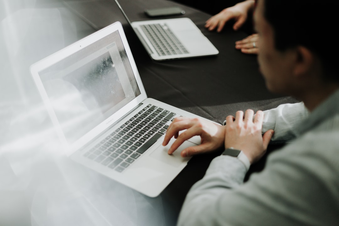 Person using laptop with AI assistant representing personal artificial intelligence agents