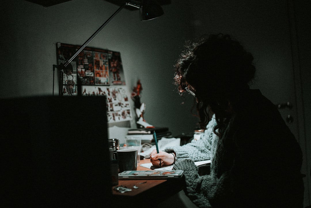 Person working intently at desk