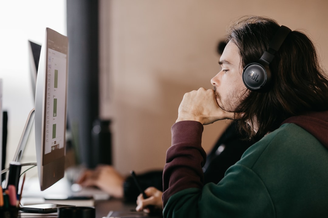 Person wearing headphones working focused