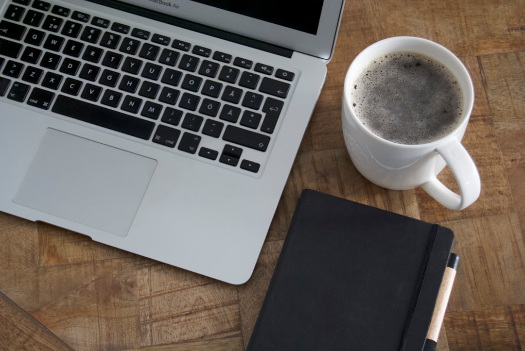 Morning routine with coffee and laptop at desk