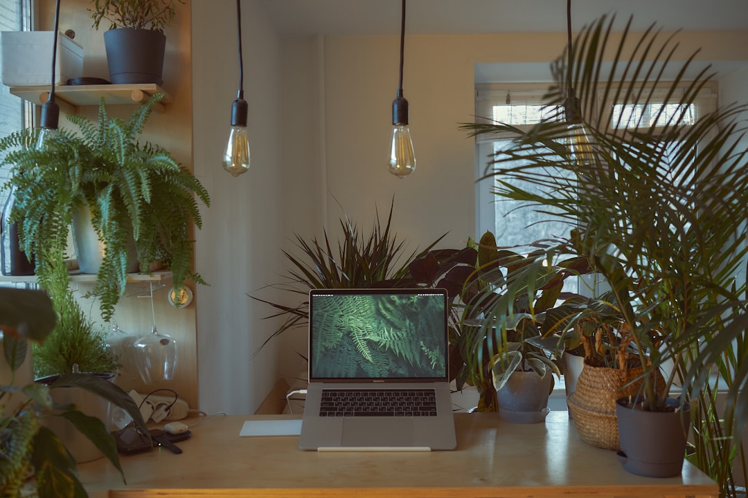 Laptop desk with cables and modern workspace