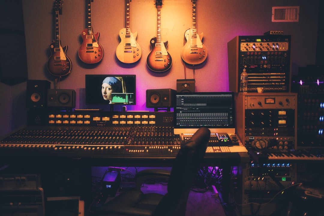 Audio mixing console and recording equipment in a studio setting