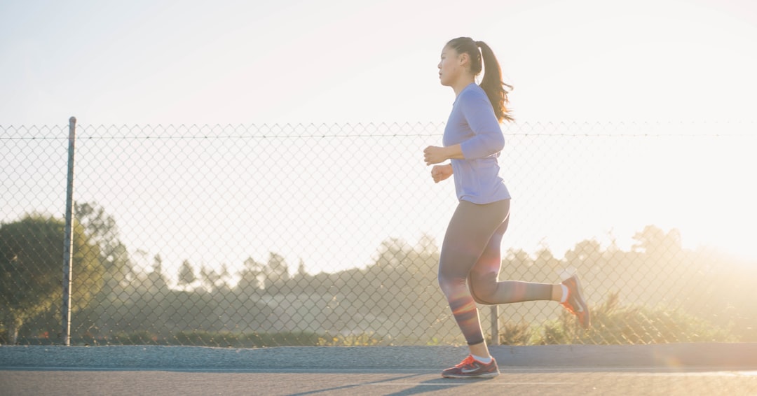 Woman walking indoors at a steady fitness pace