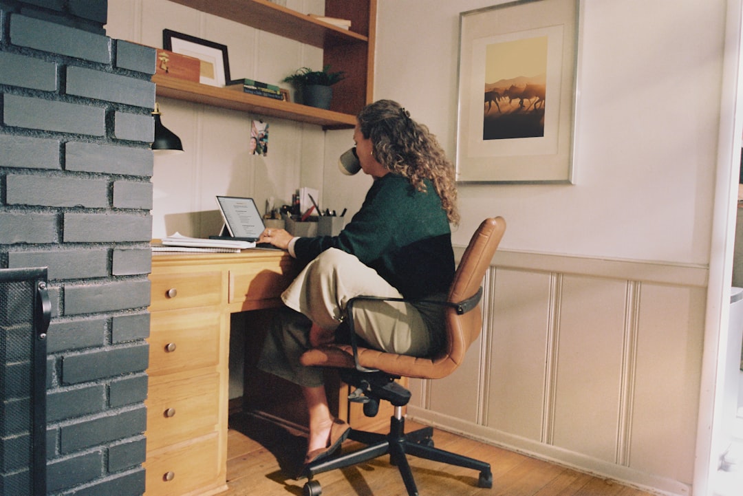 Focused worker using laptop in home office
