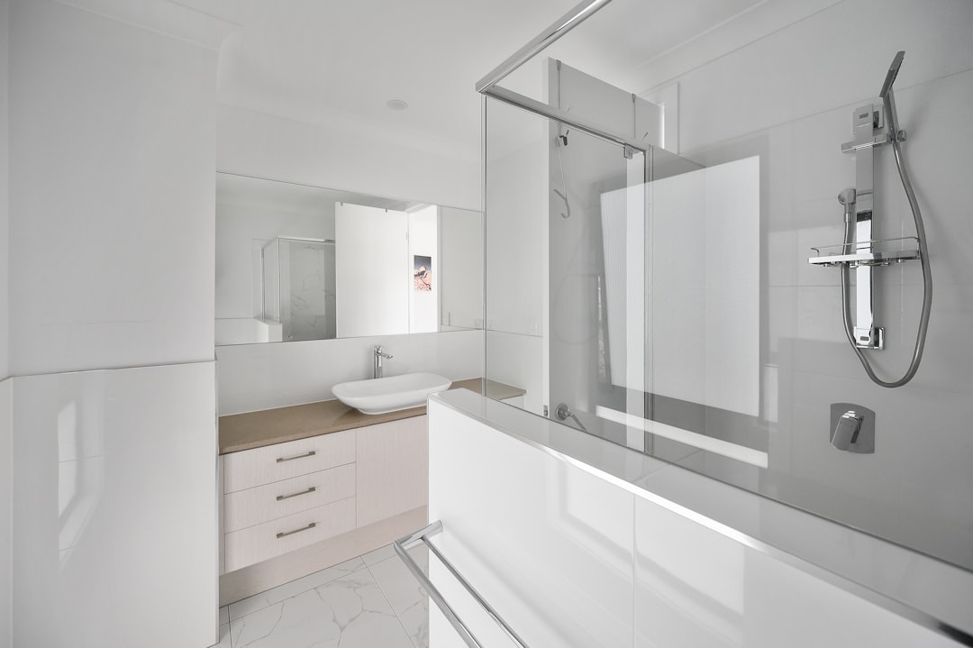 Minimalist white smart scale on bathroom floor