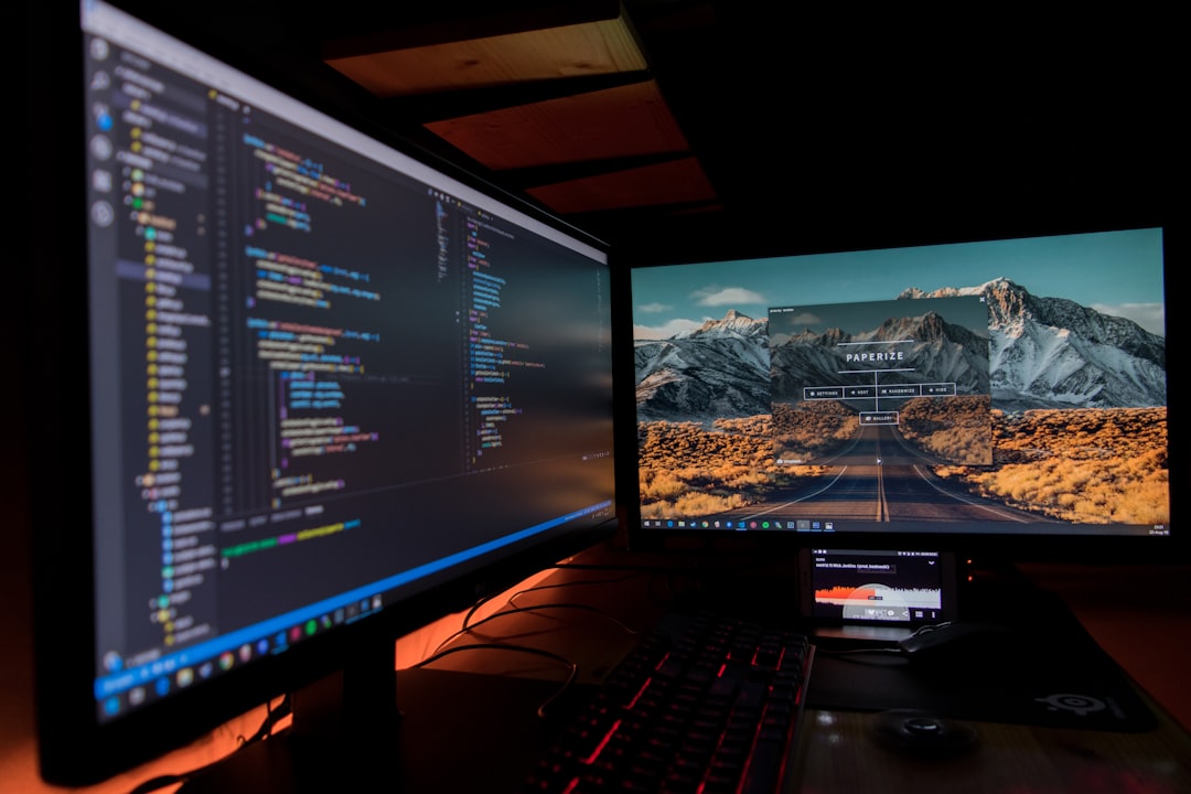 Developer workspace with multiple monitors and laptop