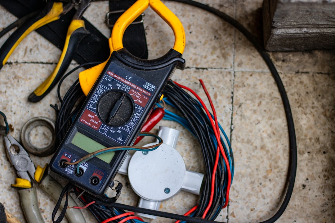 Digital multimeter testing electrical voltage