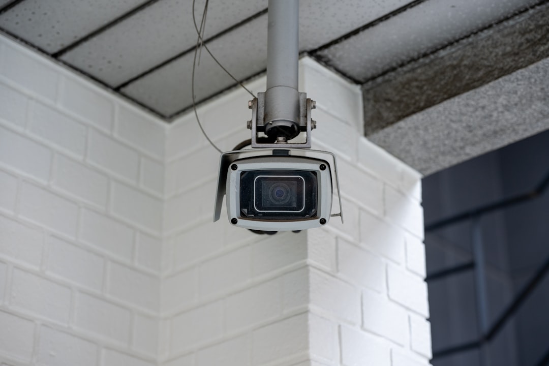 Security camera mounted on an outdoor wall