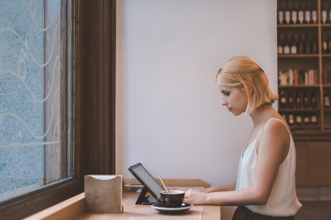 Person working on laptop at coffee shop