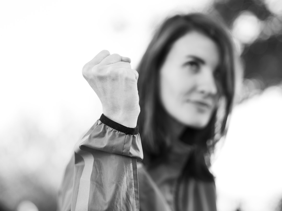 Runner adjusting smartwatch before outdoor training session