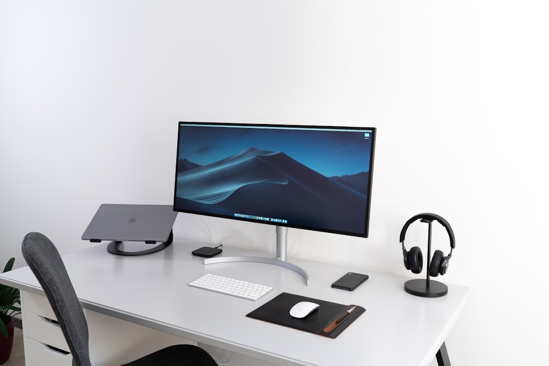 Monitor arm mount with adjustable positioning