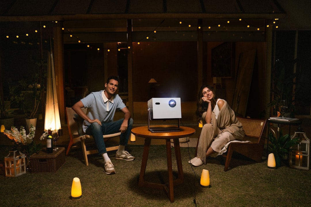 Backyard movie night setup with projector and screen