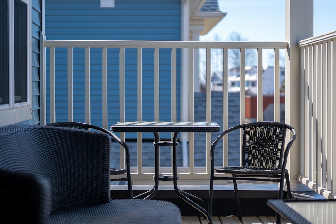 Outdoor bluetooth speaker on a deck railing