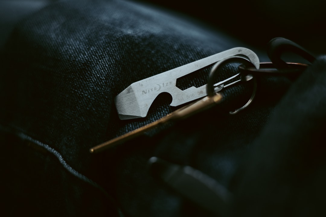 Everyday carry items and keys on a metal keychain