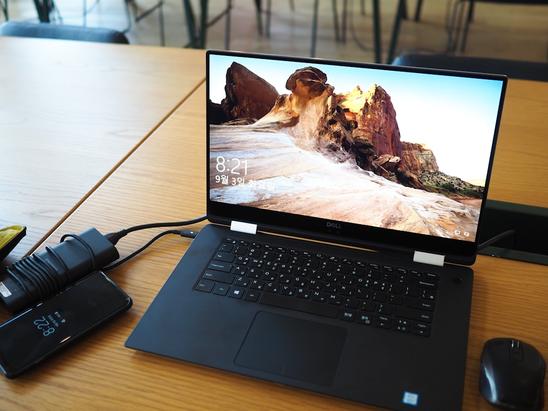 USB-C hub connected to laptop on desk with accessories