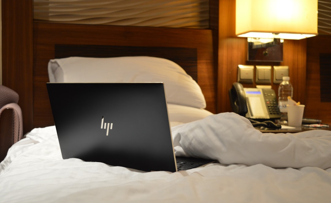 Hotel room desk with laptop set up for work
