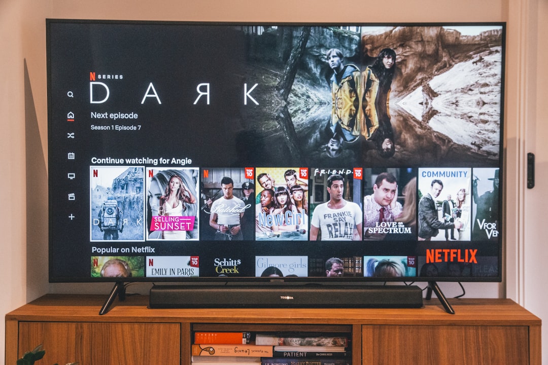 Soundbar on entertainment cabinet under TV