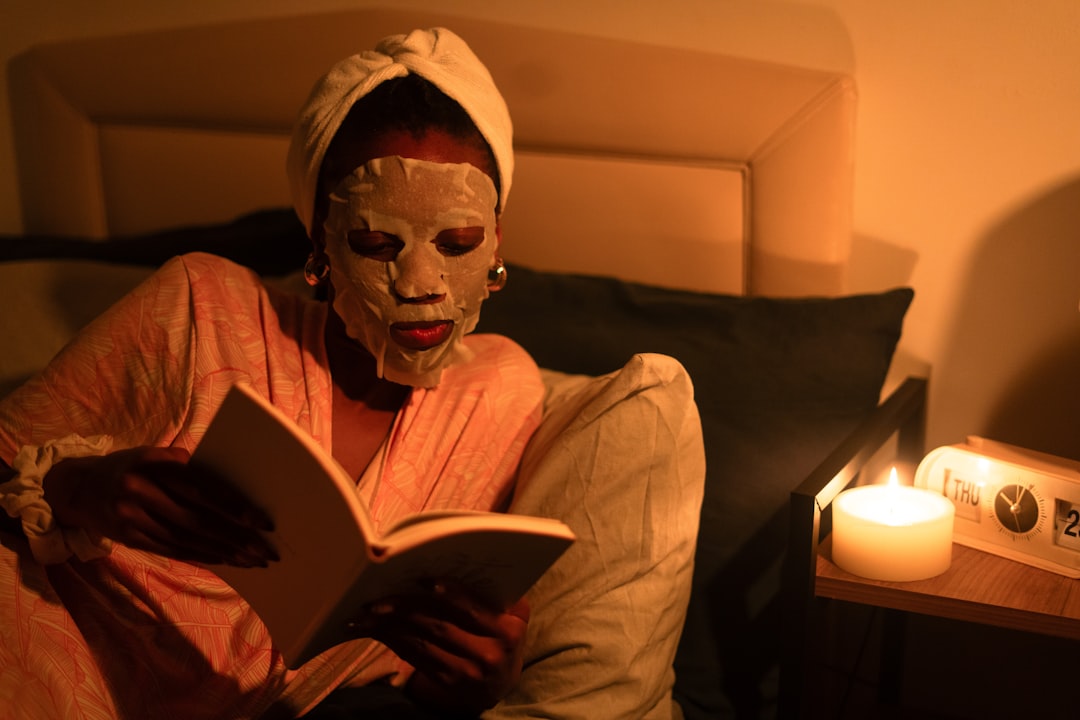 Sleep mask resting on a bedside table next to the bed