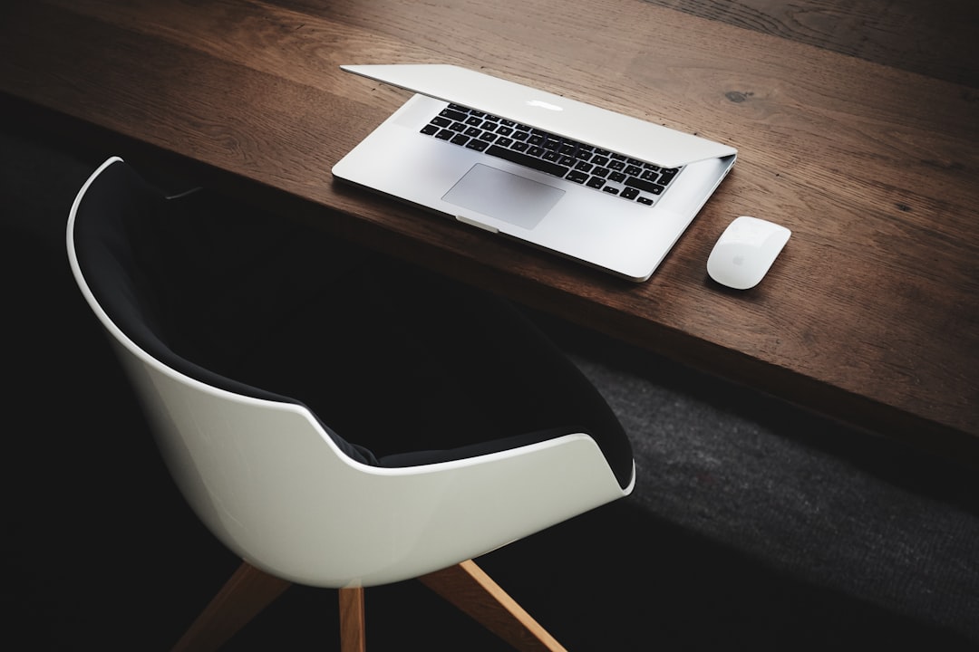 Modern laptop on clean desk with minimal accessories