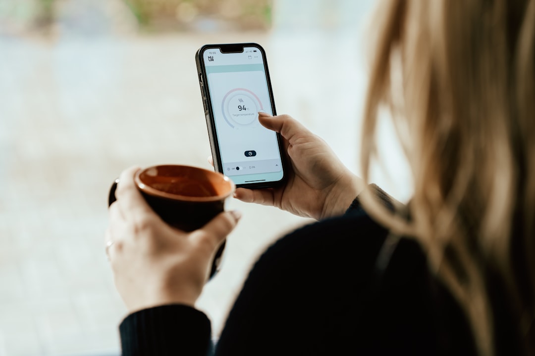 Smartphone app showing temperature control for smart mug