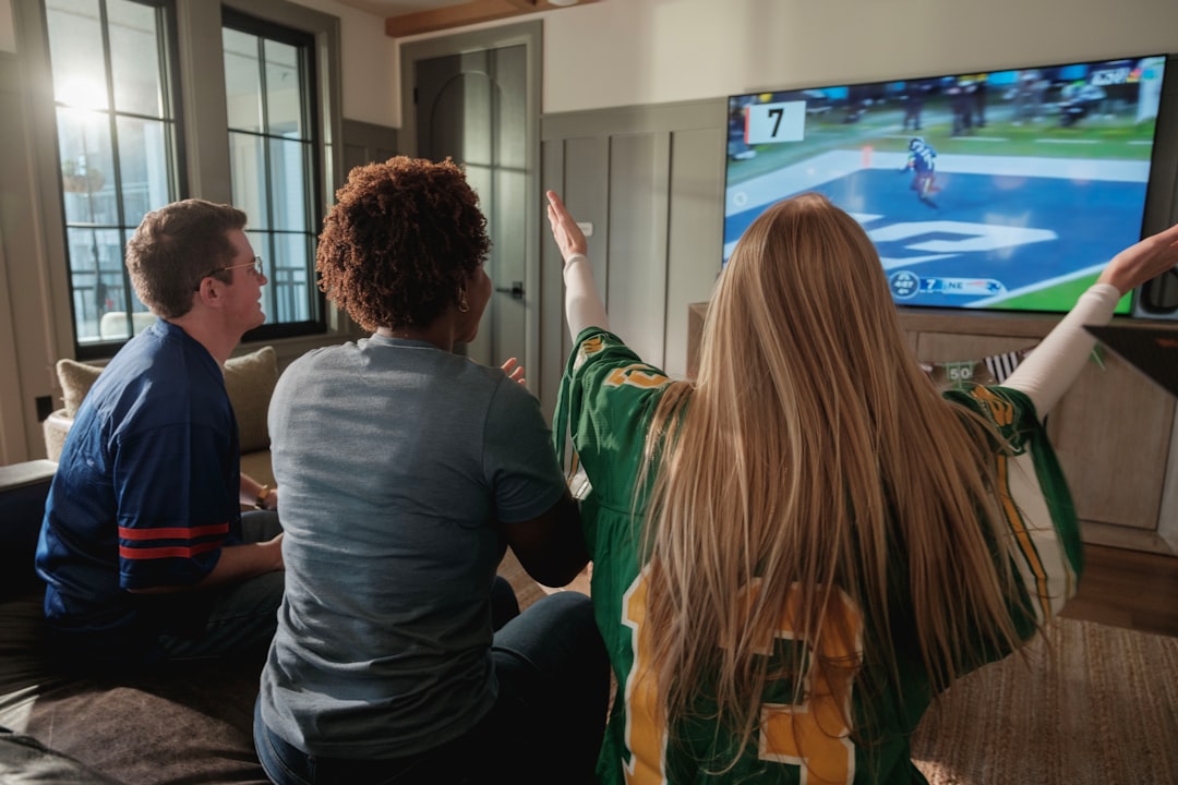 Living room TV with sports game playing