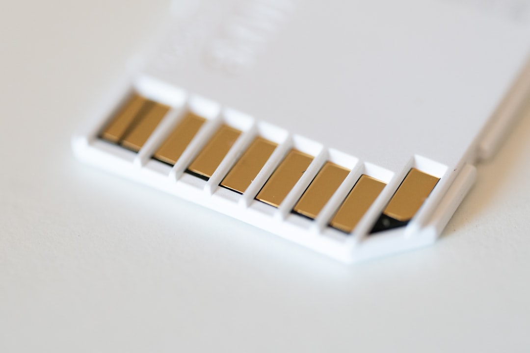 A microSD memory card held near a card slot