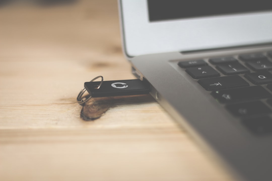 USB hardware security key plugged into a laptop