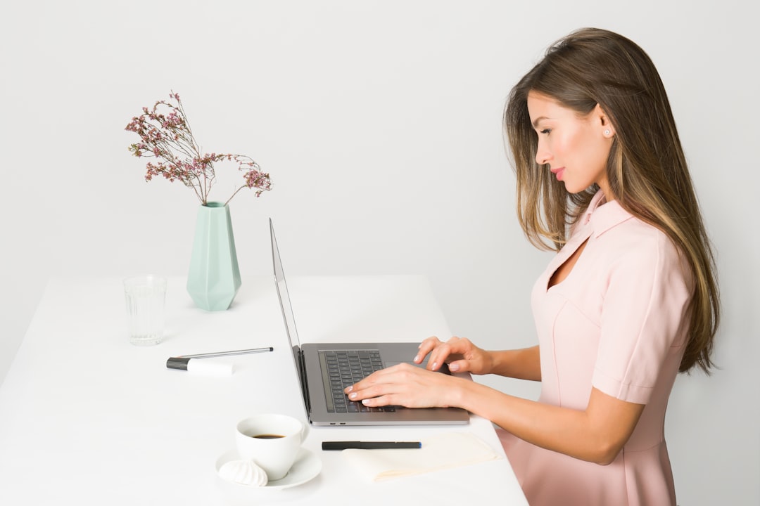 Person working at a standing desk with laptop