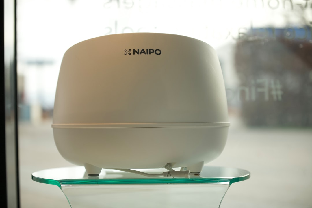 Small humidifier producing mist on a desk