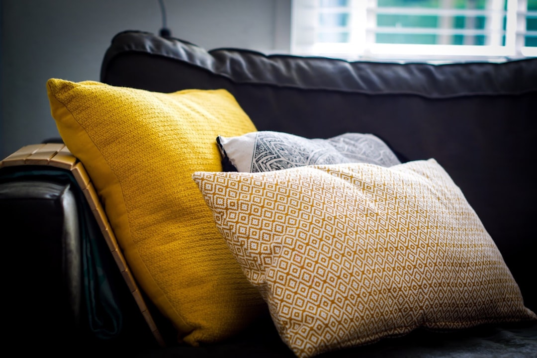 Couch with cushions and throw pillows where keys go missing