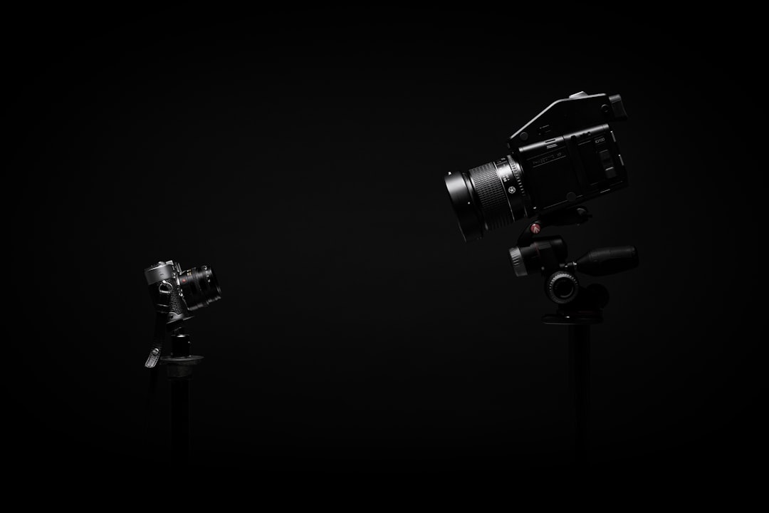 Camera lens with gimbal mechanism for motorized tracking