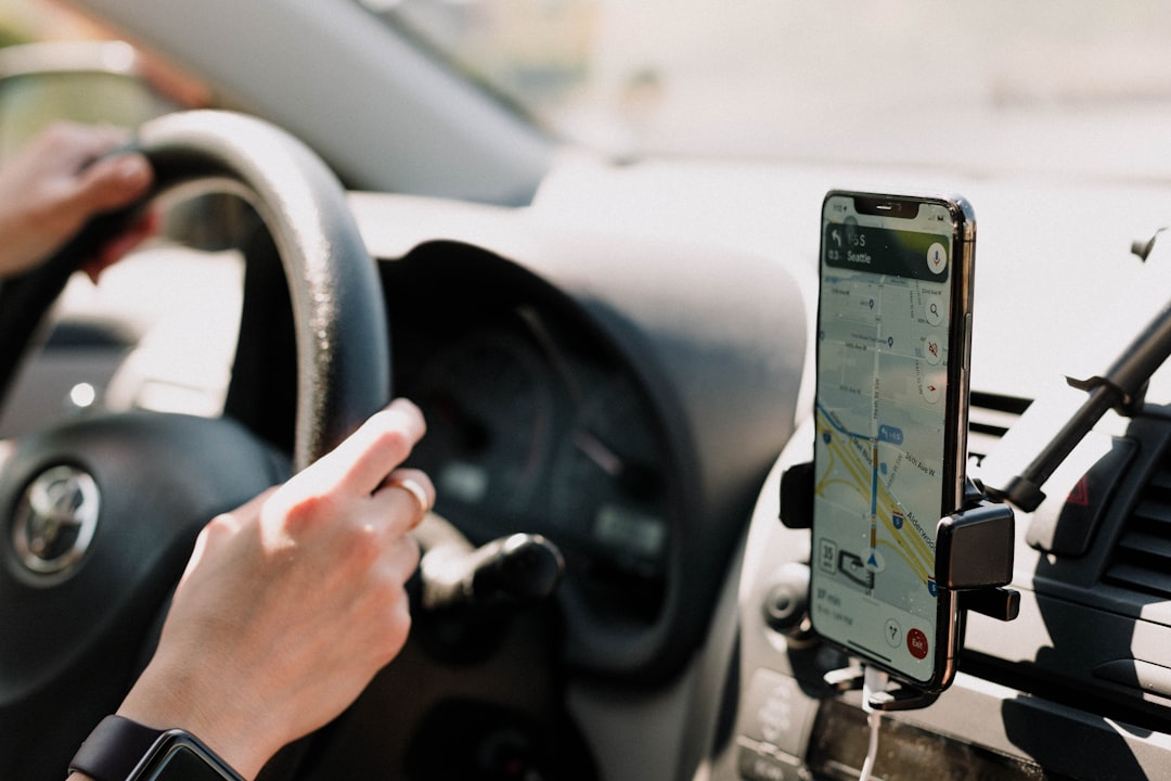 Smartphone mounted on car dashboard with GPS