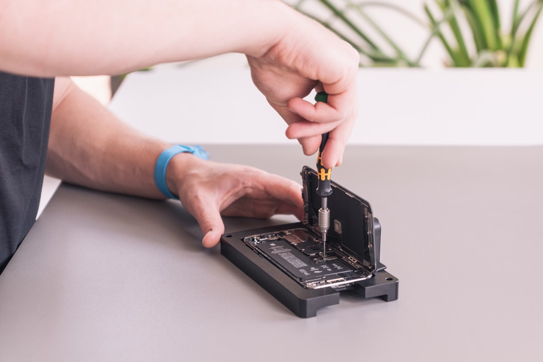 Precision screwdriver being used on small electronics
