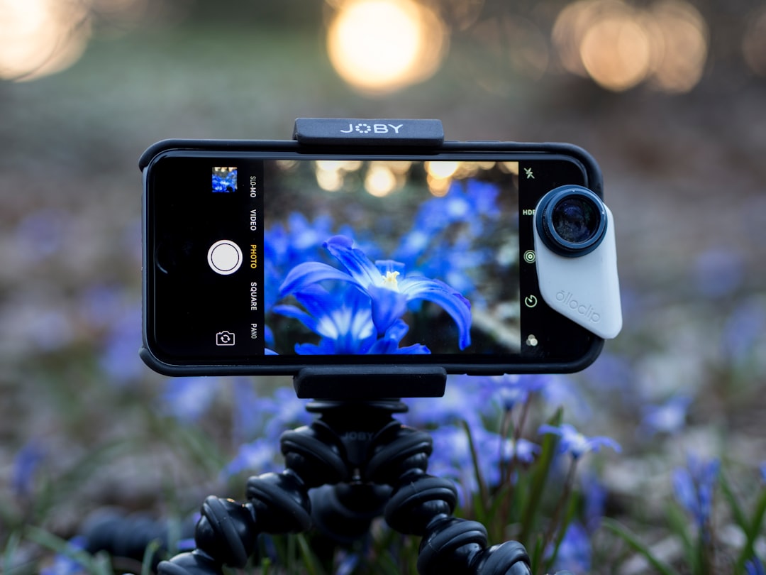 Smartphone with a thermal camera attachment connected via USB-C