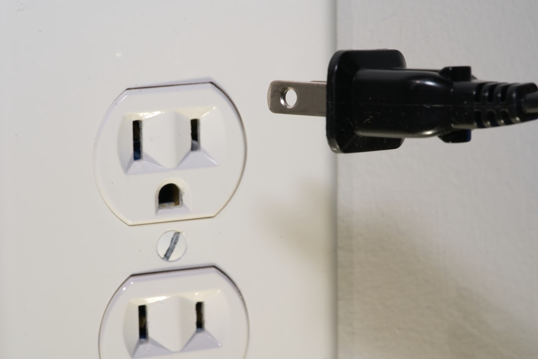 Wall charger plugged into power outlet