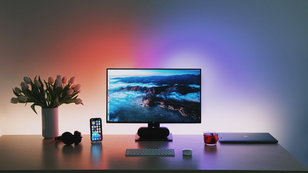 Warm desk lamp lighting near a monitor