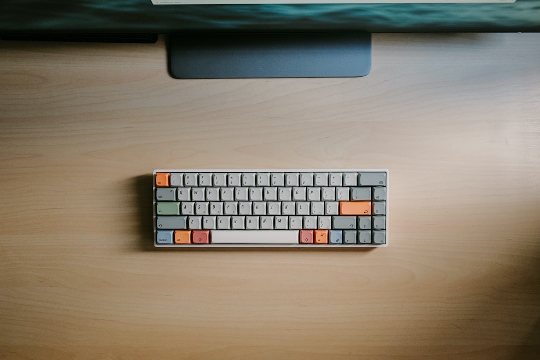 Mechanical keyboard on desk with laptop