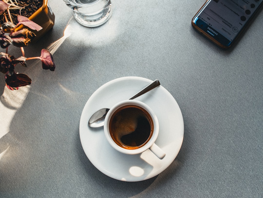 Morning coffee with smartphone check routine